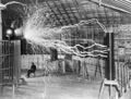 Nikola Tesla, with his equipment EDIT.jpg